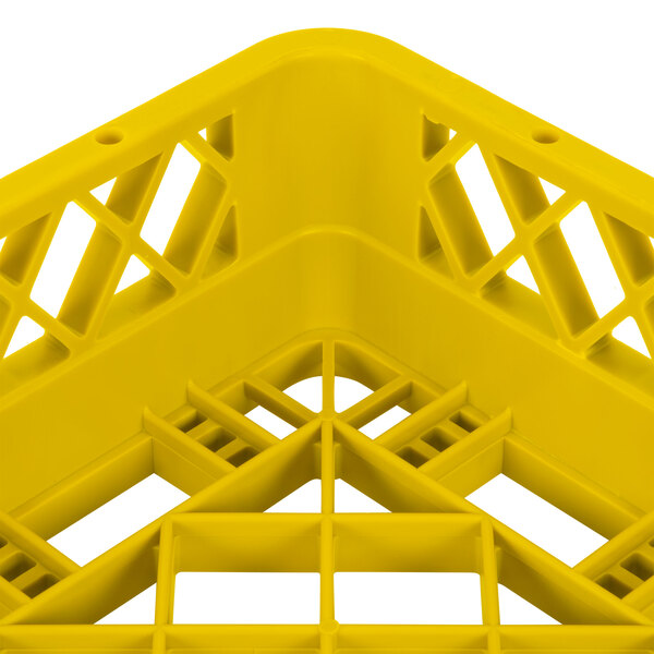 A yellow plastic Vollrath TR1 Traex full-size open rack with a grid pattern.