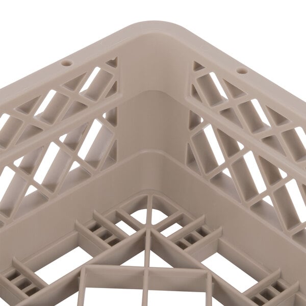 A Vollrath Traex beige dish rack with a grid pattern.