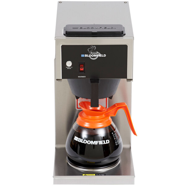 a coffee maker with a black and orange coffee pot