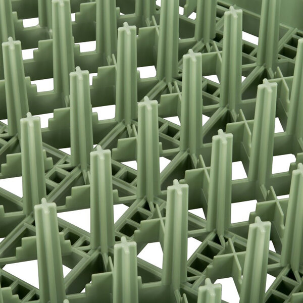 A light green full-size extended plate rack with vertical prongs for holding plates.