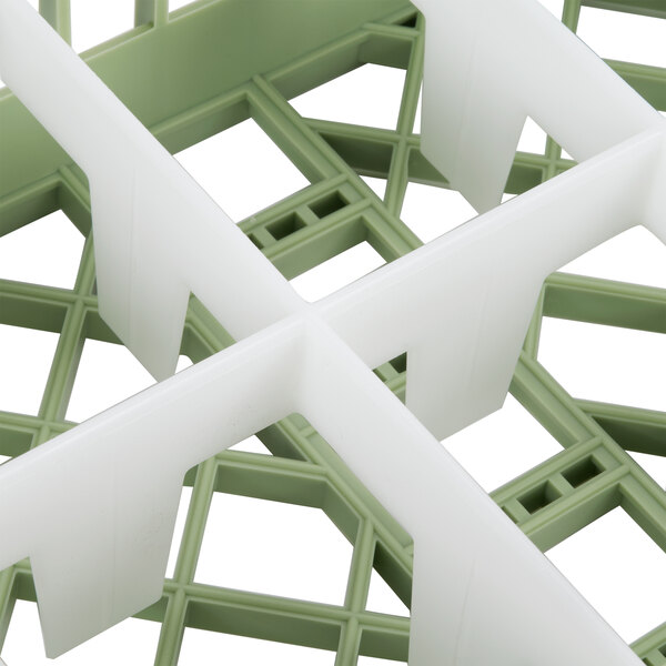 A close-up of a light green plastic Vollrath Signature rack with 10 compartments.