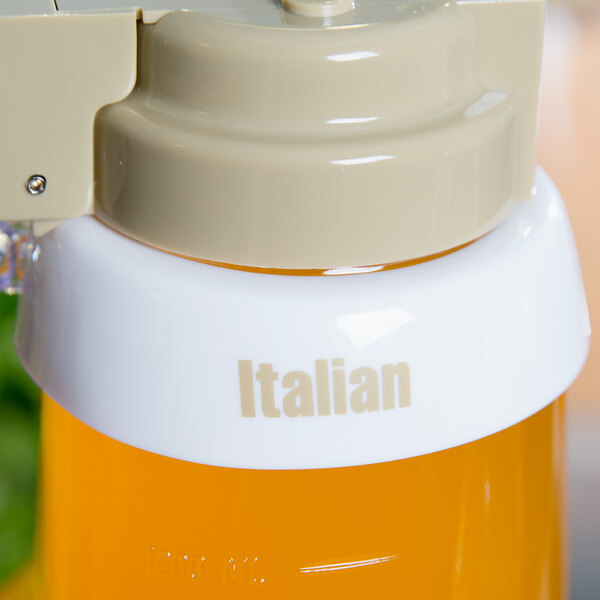 A close-up of a white Tablecraft salad dressing dispenser collar with beige lettering.