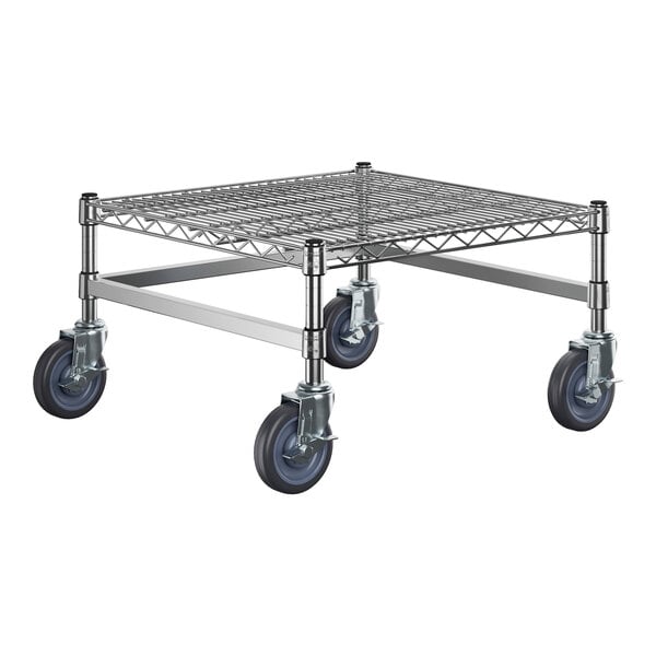 A chrome plated metal shelf with black wheels.