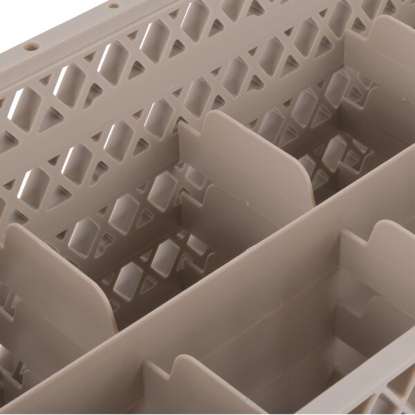A beige plastic Vollrath Traex glass rack with 10 compartments.