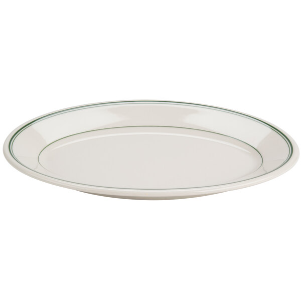 A white plate with a green rim.