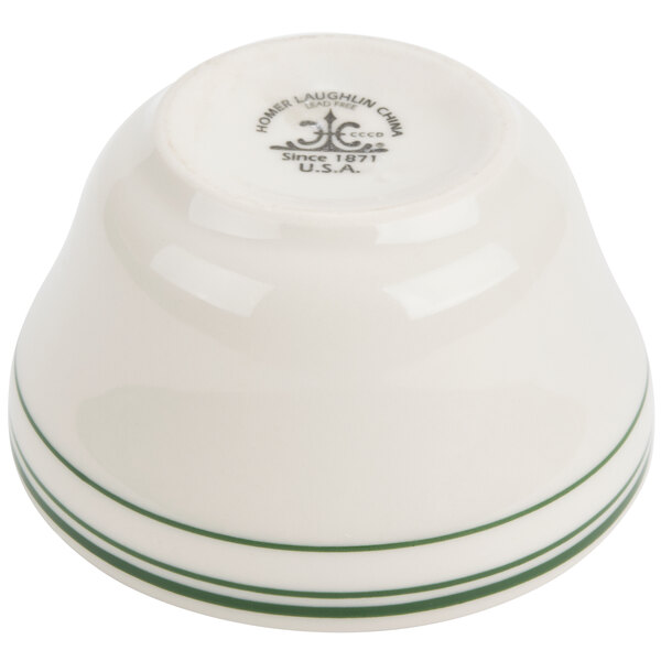 A white bowl with a green stripe around the rim.