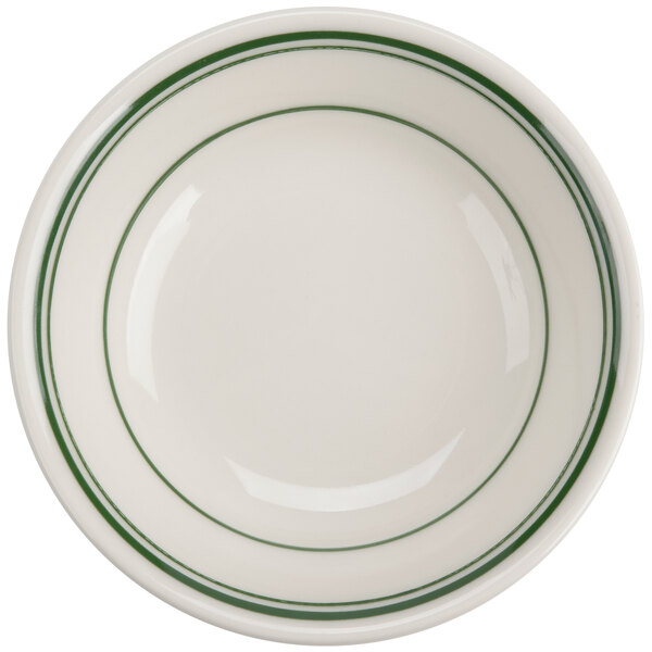 A white bowl with green lines on the edge.