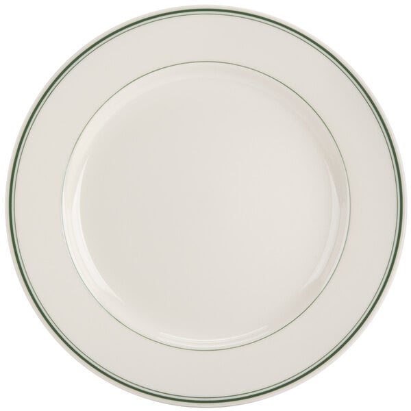 A white plate with green bands on the rim.