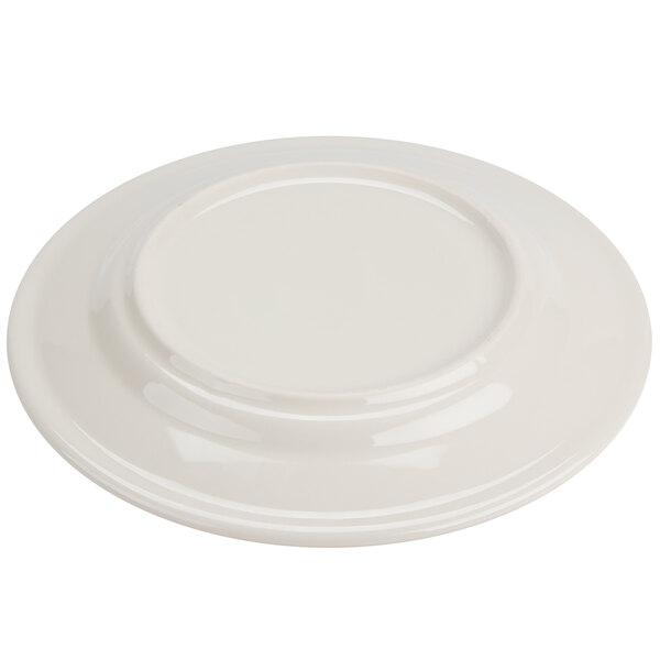 A white Homer Laughlin plate with a green band on the rim.