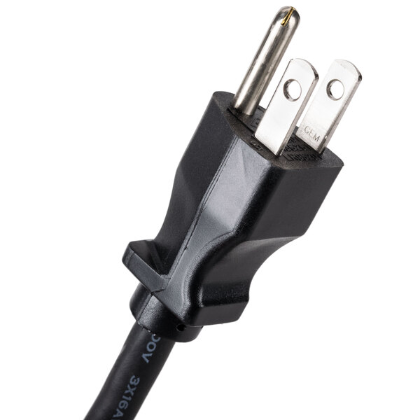 A close-up of a black power cord with two plugs on it attached to a silver metal object.
