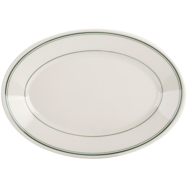 A white oval platter with green bands on the rim.