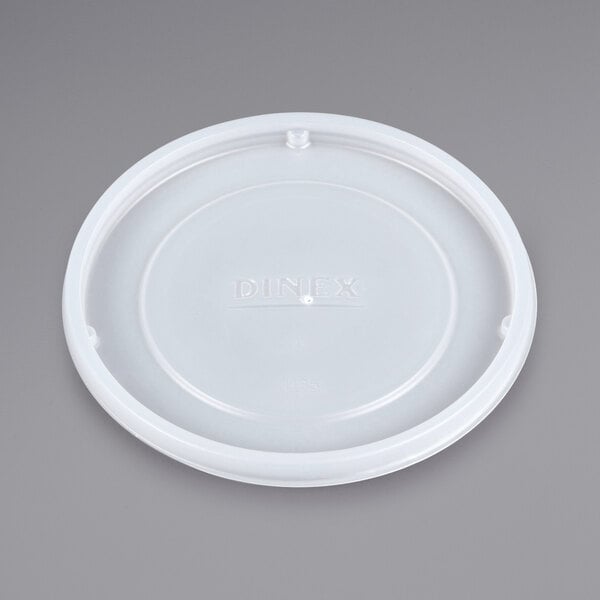A white plastic lid with the Dinex logo.