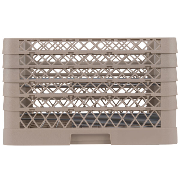 A beige plastic Vollrath Traex plate rack with 15 compartments.