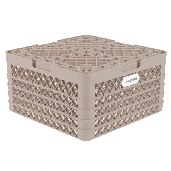 A beige plastic Vollrath Traex Plate Crate with compartments for plates.