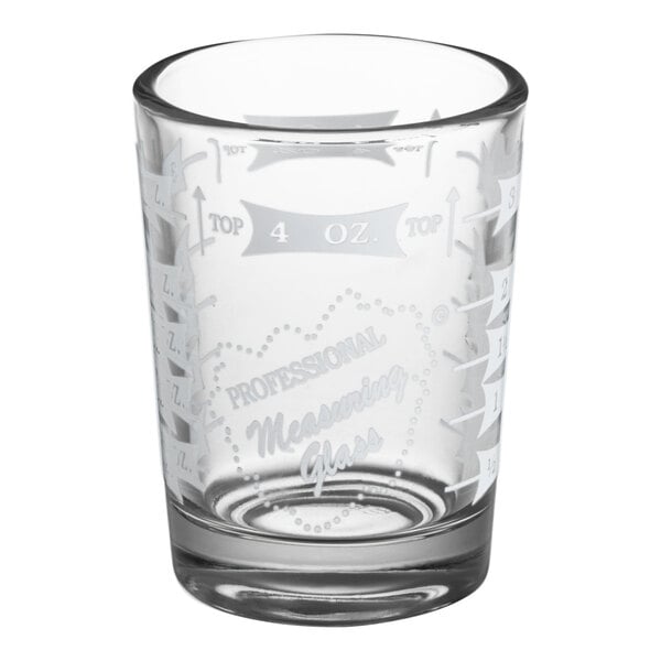 A clear Libbey measuring glass with white text.