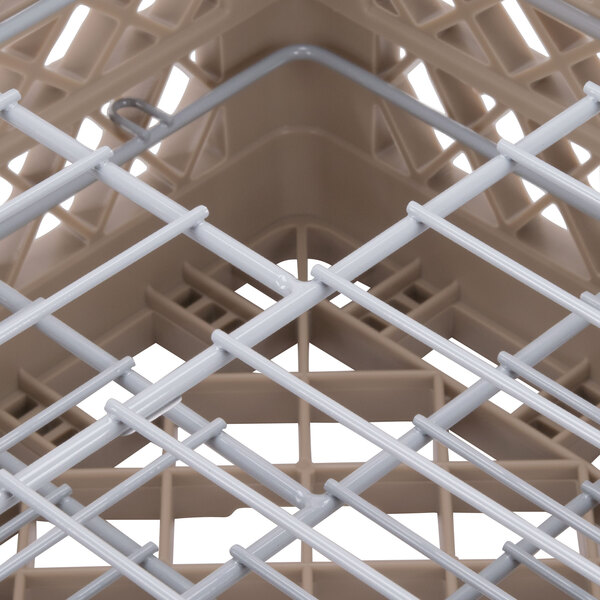 A close up of a beige wire Vollrath Traex Plate Crate.