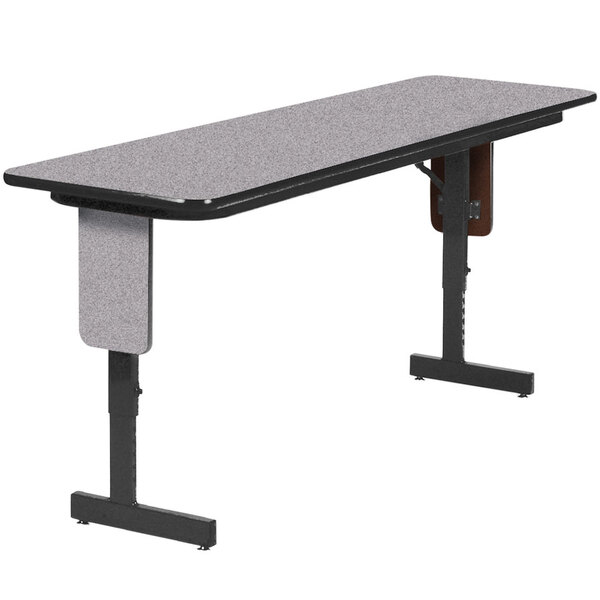 A grey rectangular Correll seminar table with black panel legs.