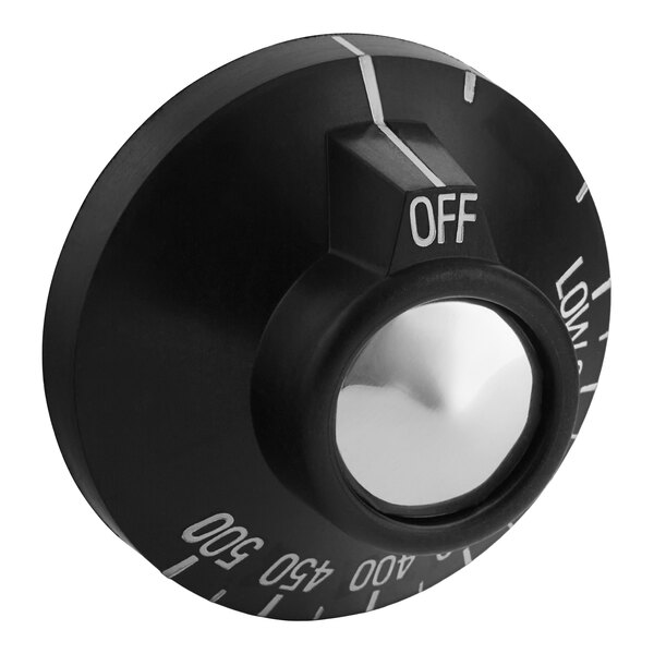 A black Garland dial control knob with white text and a white button on it.