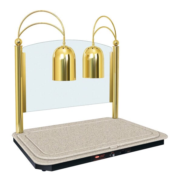 A Hatco dual lamp carving station with brass lamp shades over a heated base.