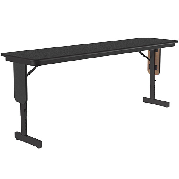 A black rectangular Correll seminar table with panel legs.