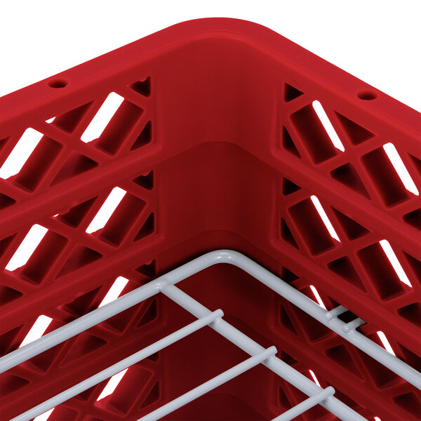 A red Vollrath Traex plate rack with white metal rods.