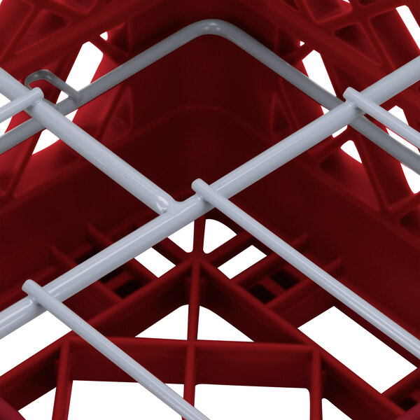 A red Vollrath Traex Plate Crate with white dividers.