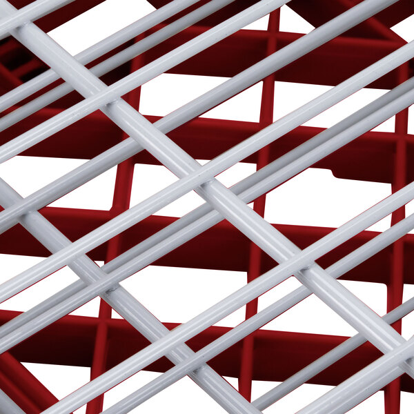 A red and white Vollrath Traex Plate Crate dish rack grid.