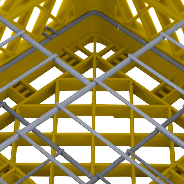 A yellow Vollrath Traex Plate Crate with metal bars on it.