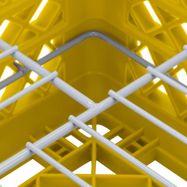 A yellow Vollrath Traex Plate Crate with white rods.