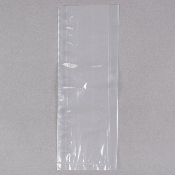 A close-up of a clear plastic LK Packaging food bag with a hole in it.