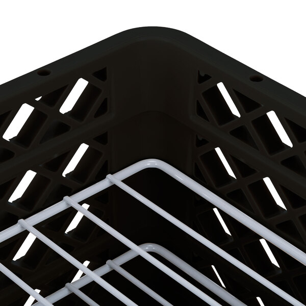 A black plastic Vollrath Traex Plate Crate with white dividers.