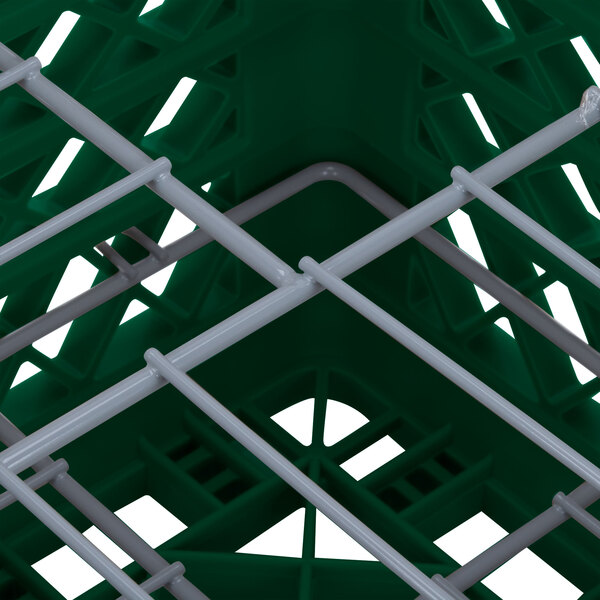 A green Vollrath Traex plate rack basket with metal bars.