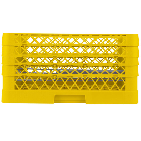 A close-up of a yellow plastic rack with compartments for plates.