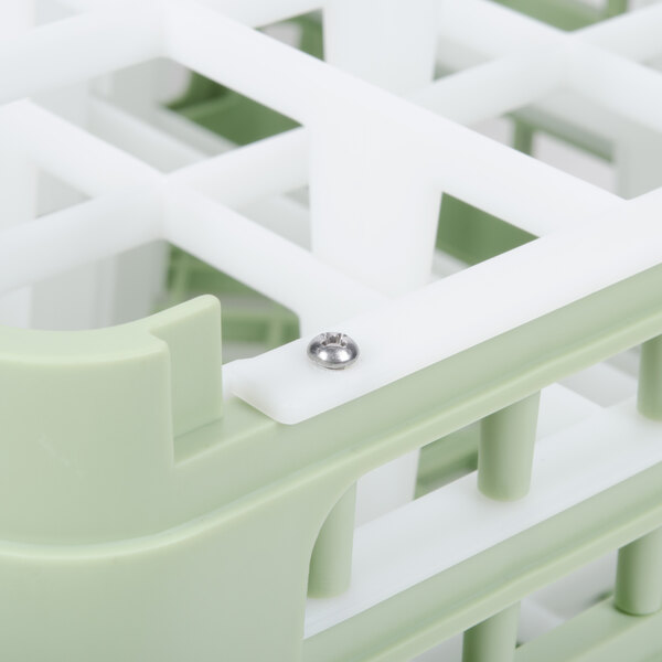 A white and green plastic basket with a metal screw on the bottom.