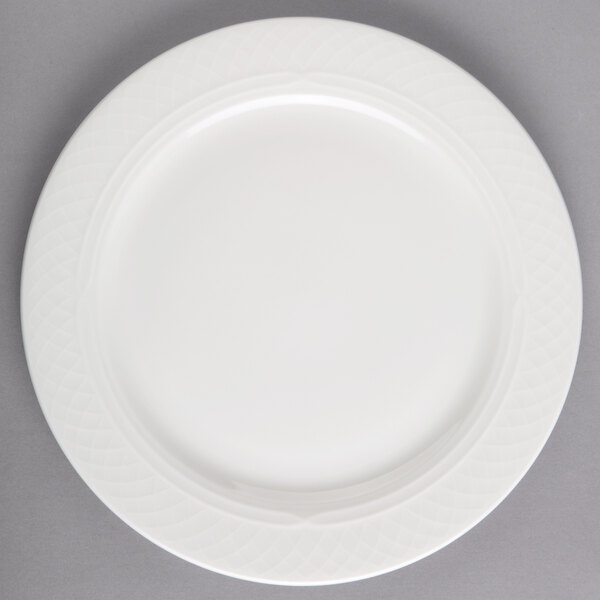 A Homer Laughlin Kensington Ameriwhite bright white china plate with a circular design on it.