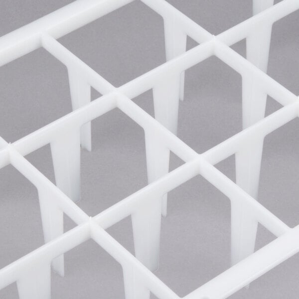 A white plastic grid with holes.