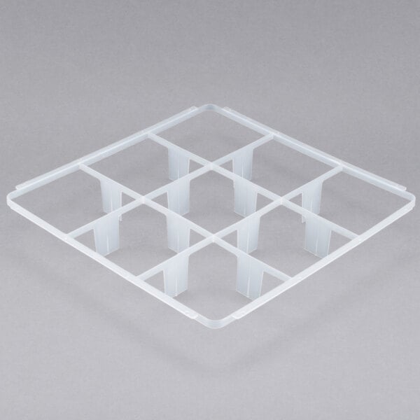 A white plastic grid tray with 9 compartments and holes.