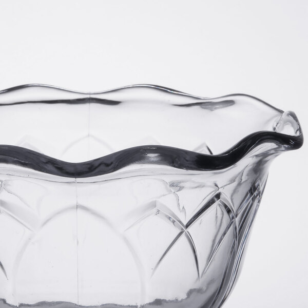 A clear Dinex Fenwick cup with a wavy design.