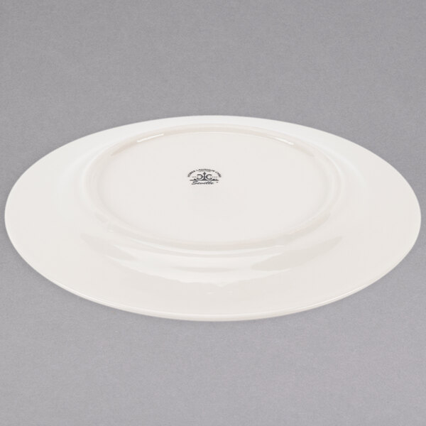 A Homer Laughlin ivory china plate with a black design on it.