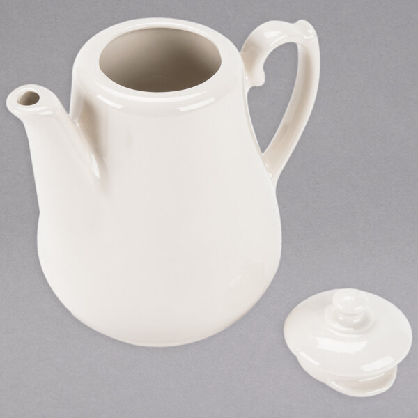 A white Homer Laughlin China teapot with a lid.
