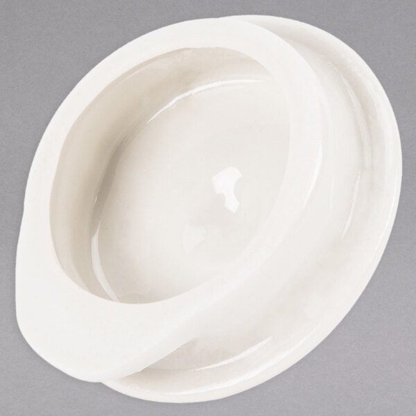 A white Homer Laughlin China beverage server with a lid.