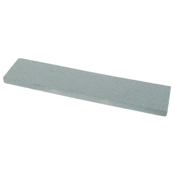 A grey rectangular Victorinox Crystolon sharpening stone.