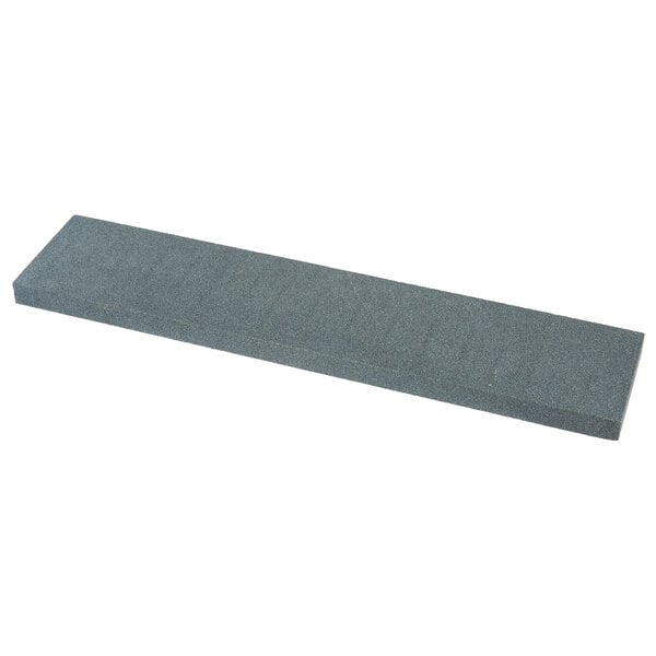 A grey rectangular Victorinox Crystolon sharpening stone.