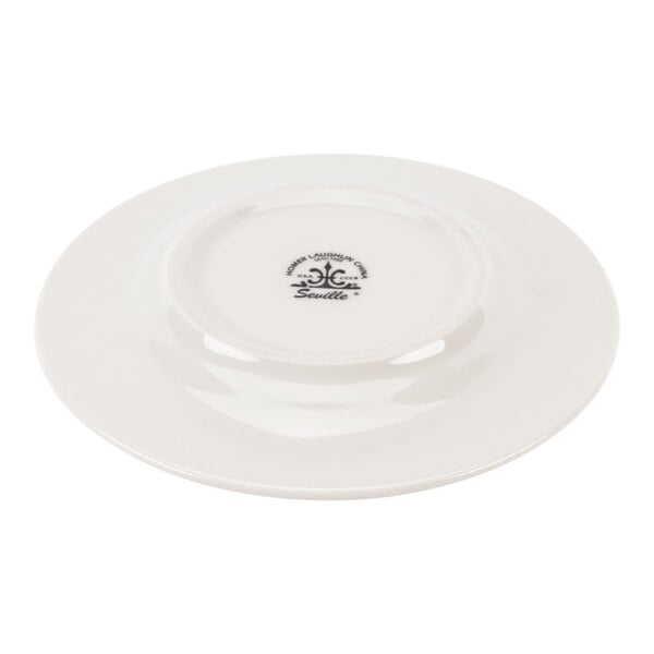 A white ceramic plate shown upside down, displaying a manufacturer's mark on the bottom.