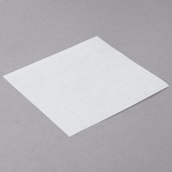 Choice white square patty paper on a white background.