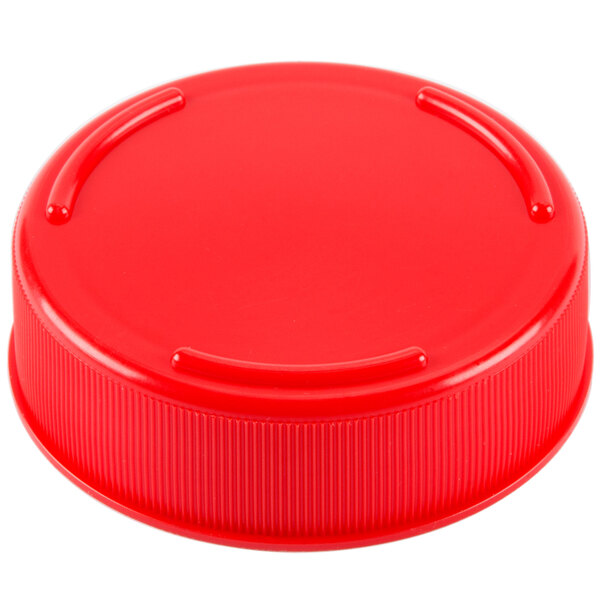 A close-up of a red plastic bottle cap.
