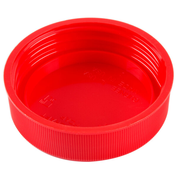 A close-up of a red plastic bottle cap.