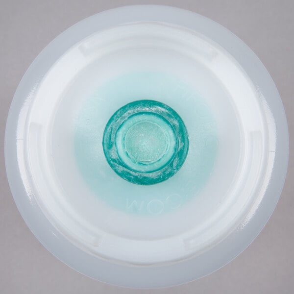 A close up of a blue squeeze bottle with a white background.