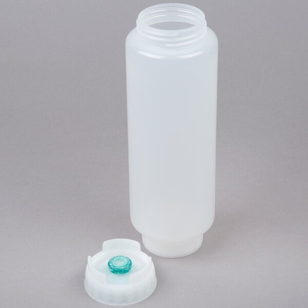 A white plastic bottle with a green cap and a thin black valve.