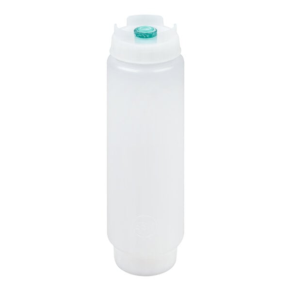 A translucent plastic squeeze bottle with a white cap and a green dispensing valve on top.
